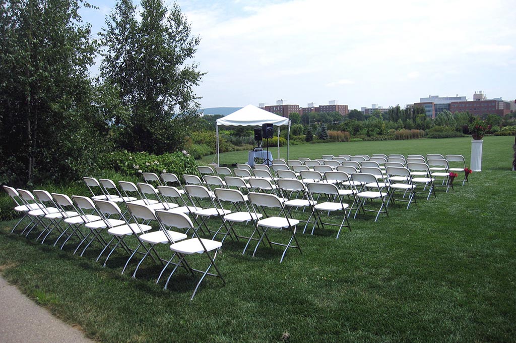 rows of chairs assembled for outdoor wedding
