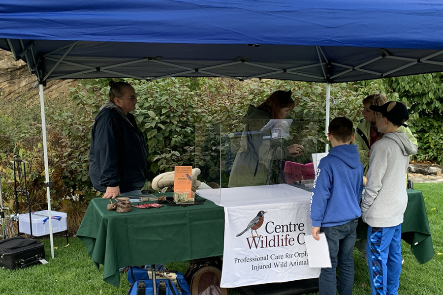 wildlife rescue organization volunteers behind a table