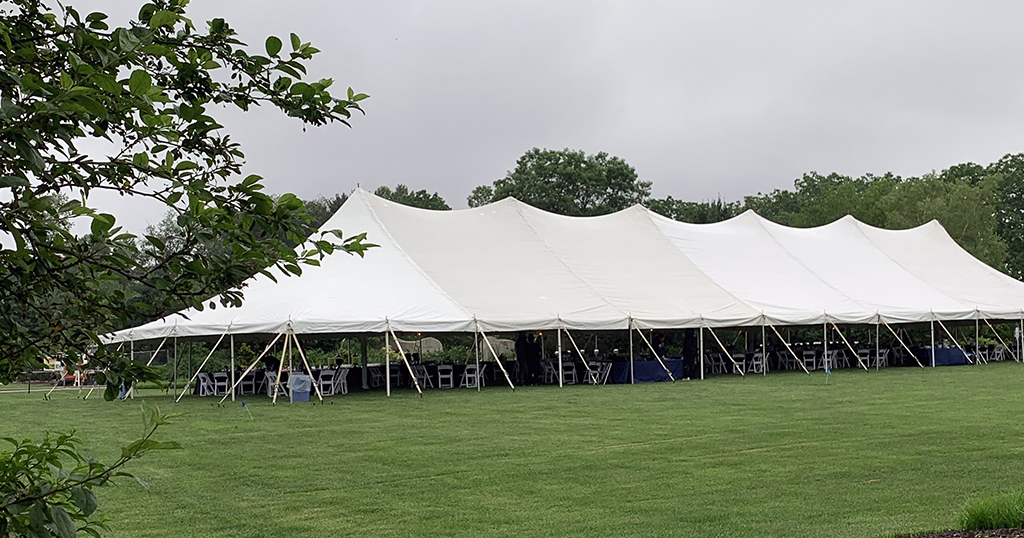 large event tent erected in an open field