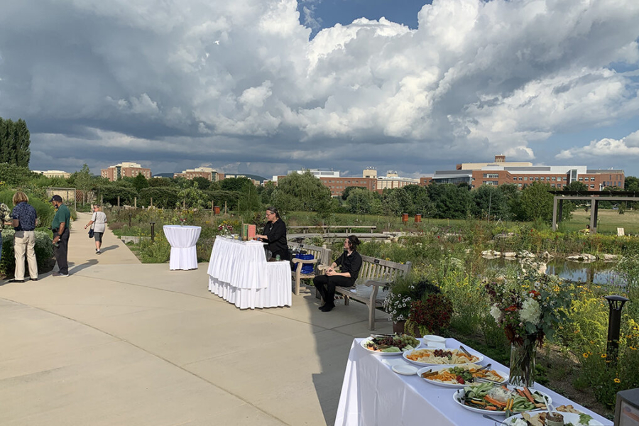 visitors gather at tables during special event