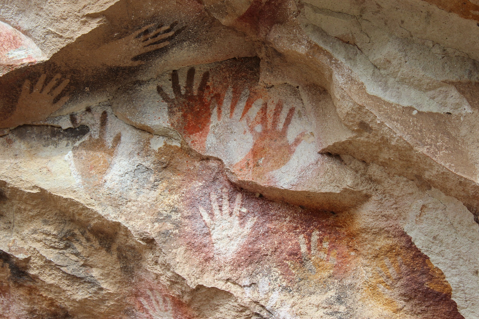 Cave art featuring painted hand prints
